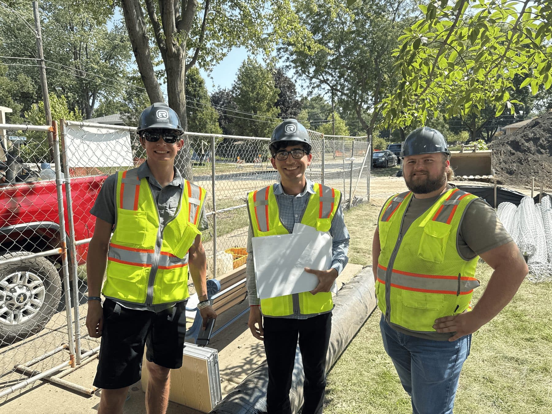 Jeffrey on a construction site visit in a hard hat and high-visibility vest