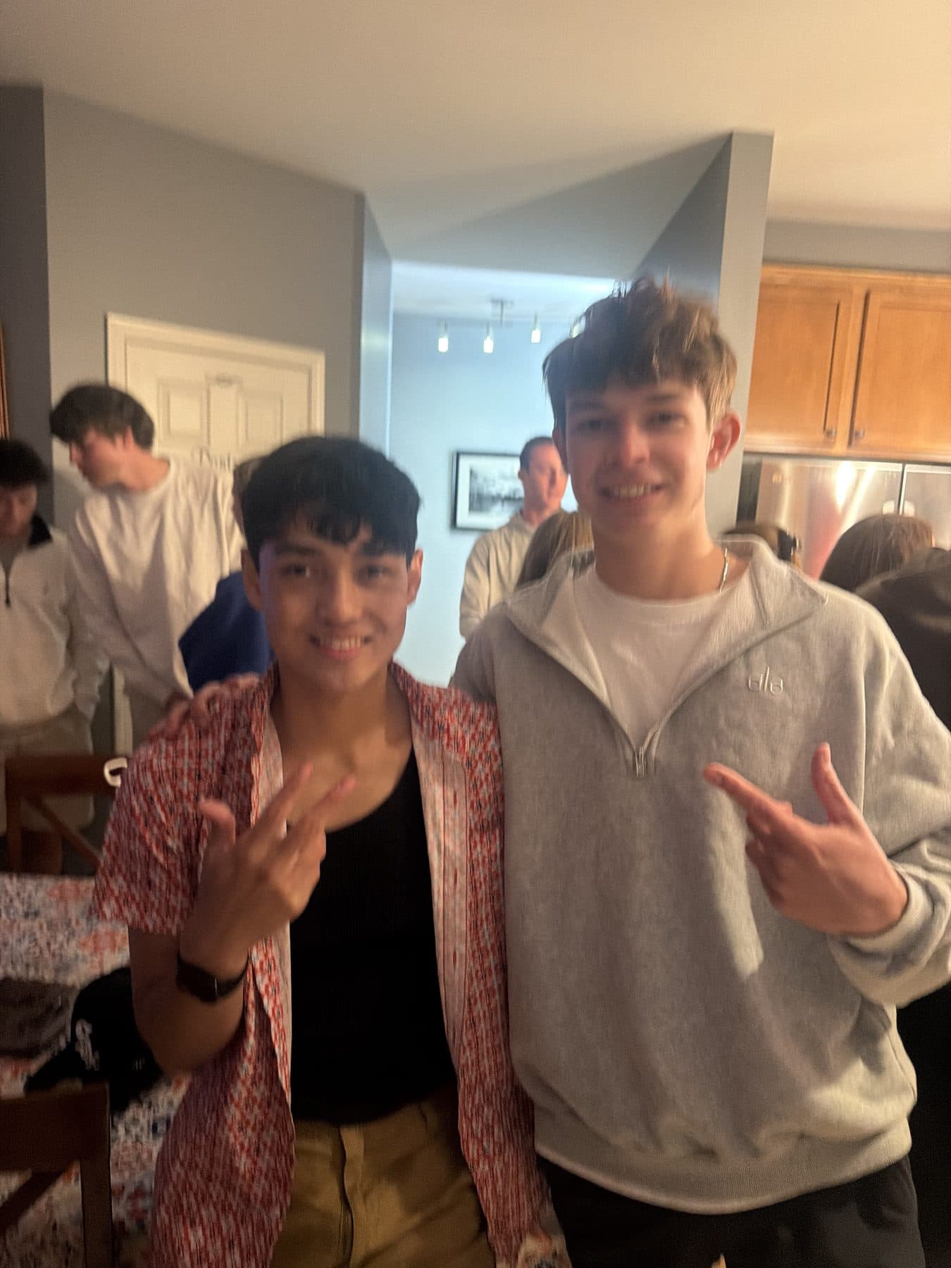 Jeffrey and a friend at a get-together indoors