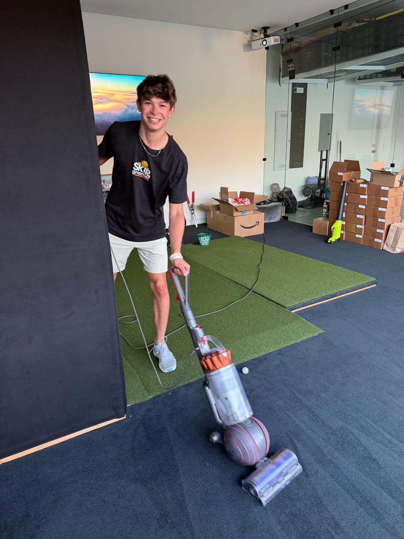 Jeffrey resetting the set between takes on a Skip The Groomer content shoot